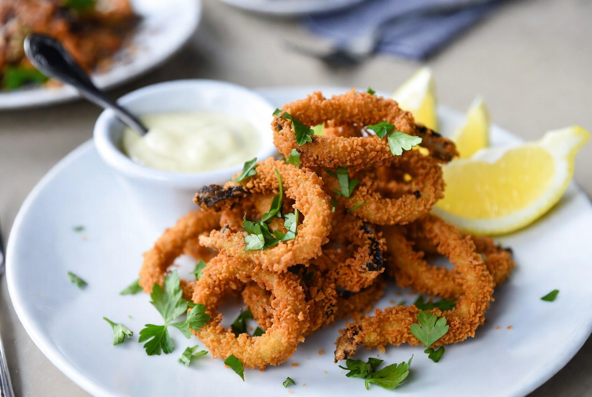 Crispy vegan calamari made with oyster mushrooms as plant-based seafood alternative