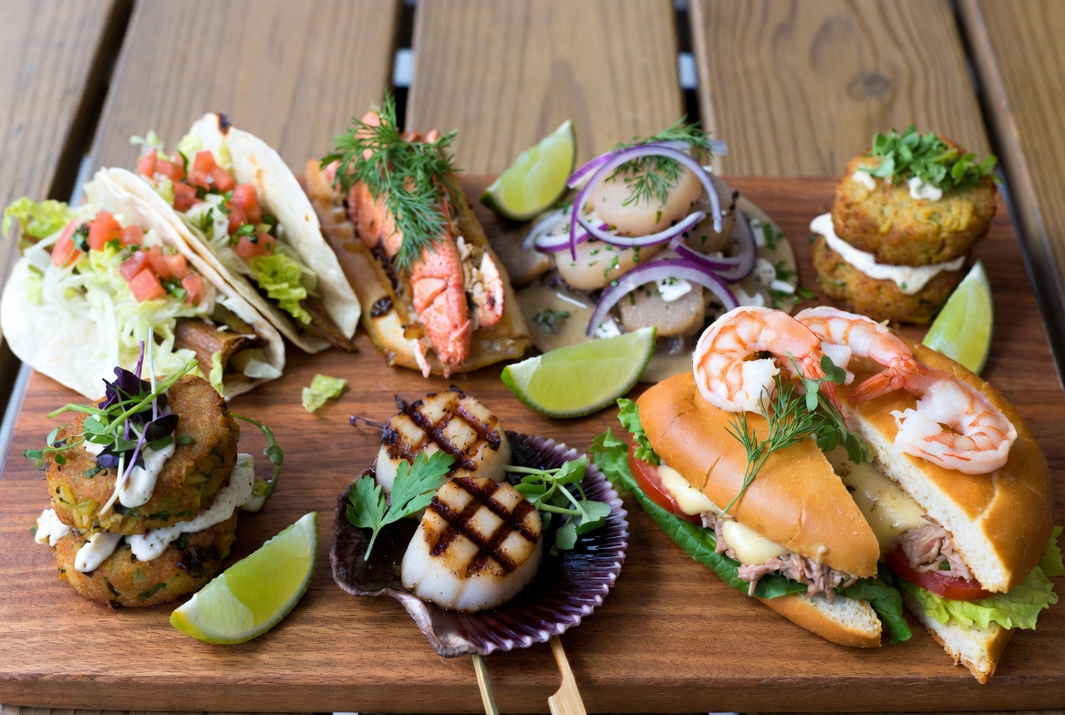 Seven delicious plant-based seafood alternatives including fish tacos, lobster rolls, crab cakes and mushroom scallops